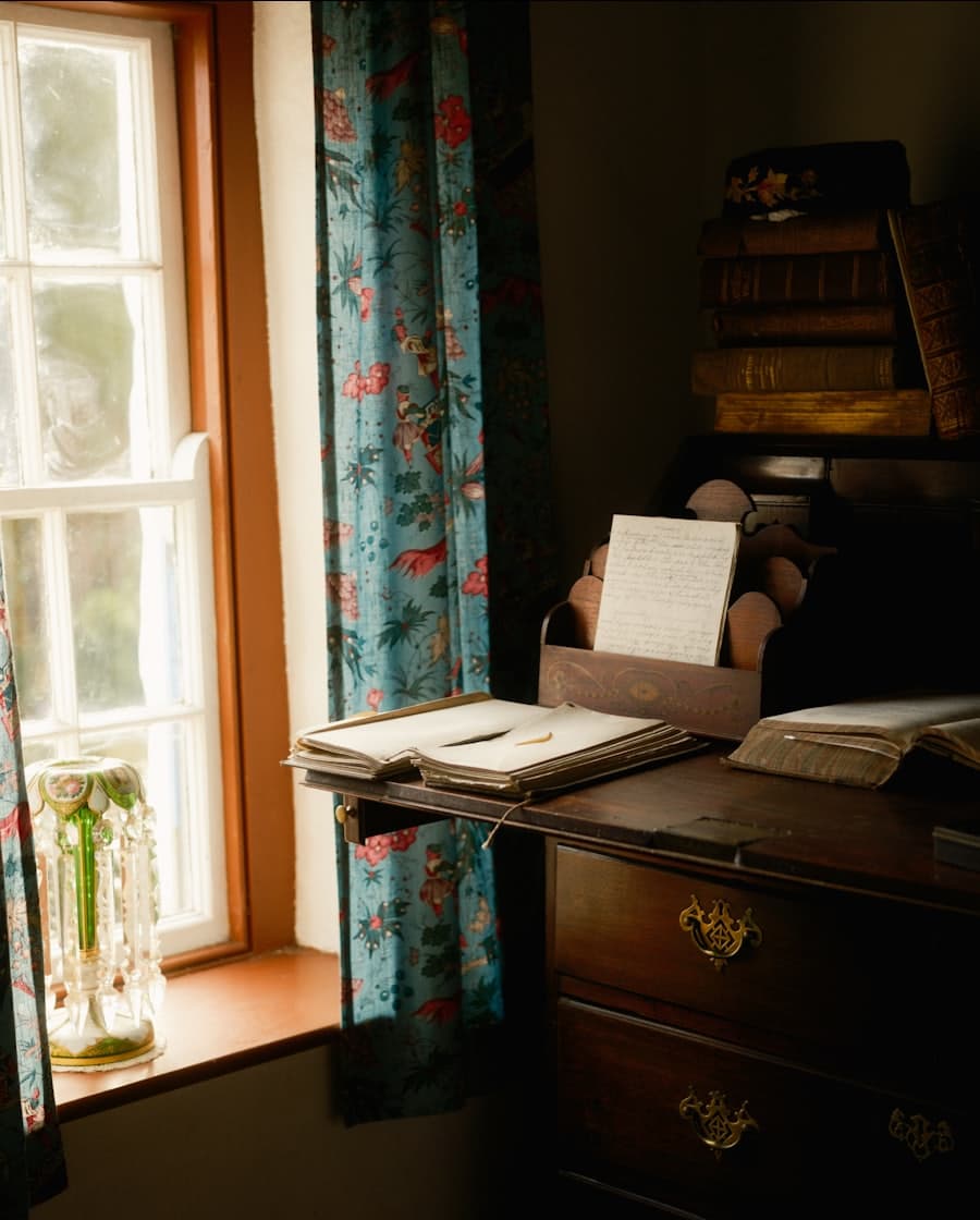 A writing desk beside a window
